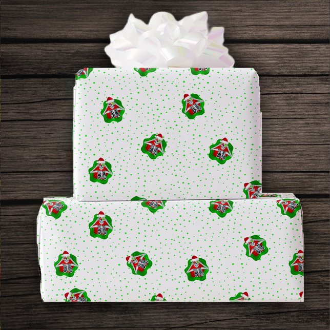 Fun Skeletons Ornaments Santa Hats Spatter shapes Wrapping Paper (Fun Skeletons in Santa hats in splatter shapes on white with green dots roll of gift wrapping paper.)