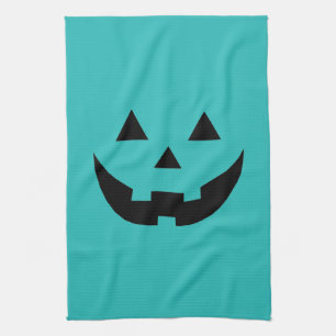 Fun teal jack o lantern pumpkin face Halloween Tea Towel