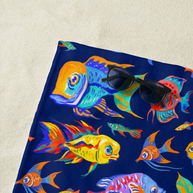 Fun tropical fishes on dark blue beach towel (In Situ)