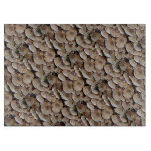fun vegatable picture of fresh button mushrooms cutting board
