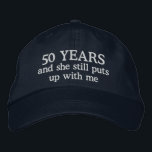 Funny 50th Anniversary Mens Hat Gift Cap<br><div class="desc">50th wedding anniversary gift for him says 50 years and she still puts up with me on an embroidered ball cap hat for the man married 50 years to the same wife.</div>
