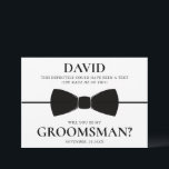 Funny and Elegant Custom Groomsman Proposal Card<br><div class="desc">Make your groomsman proposal both memorable and stylish with this elegant card. Personalised with the recipient’s name, it features a playful message: "This definitely could have been a text (she made me do this). Will you be my Groomsman?" A sleek black bow tie design adds a touch of sophistication, while...</div>