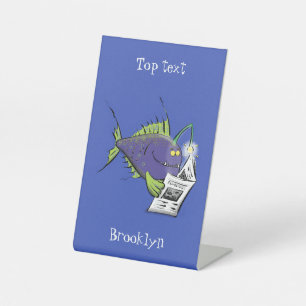 Funny angler fish cartoon pedestal sign