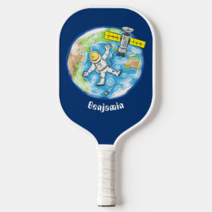 Funny astronaut in space and earth cartoon pickleball paddle
