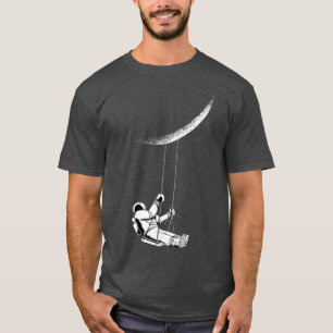 Funny astronaut swings on crescent moon  T-Shirt