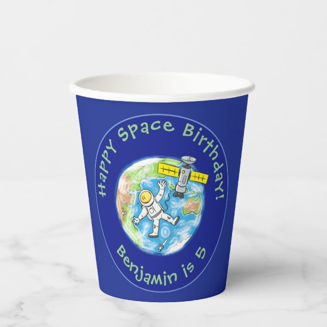 Funny astronaut with satellite over earth cartoon paper cups (Front)