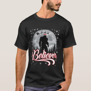 Funny Believe Christmas Bigfoot Santa Hat Moon Sce T-Shirt