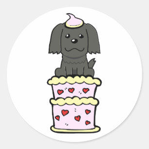 Funny black dog jumping out of a cake classic round sticker
