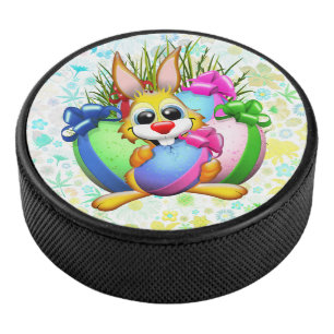Funny Bunny biting an Easter Egg Hockey Puck