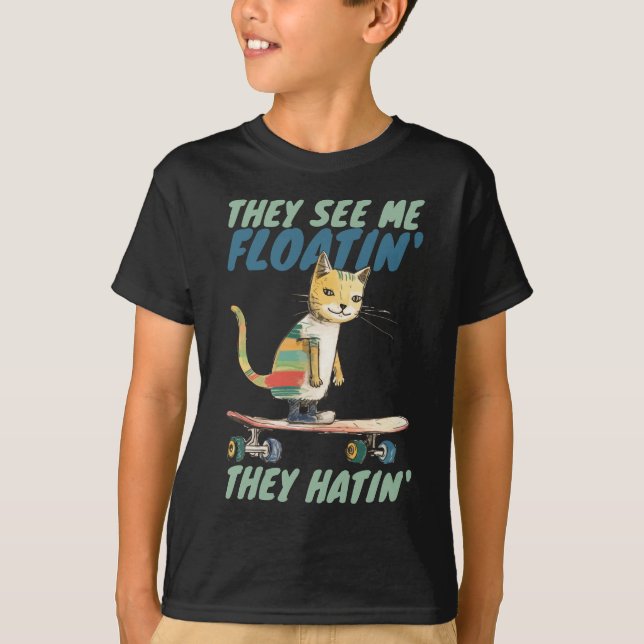 Funny calico cat street skate boarding they hatin T-Shirt (Front)