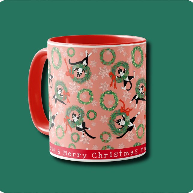 Funny Cat and Christmas Wreath Mug (Cute tuxedo cats play in festive Christmas wreaths on poinsettia pink background. Personalize it.)