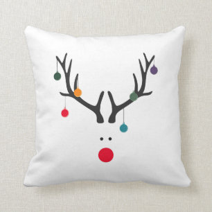 Funny cute minimalist reindeer on white cushion