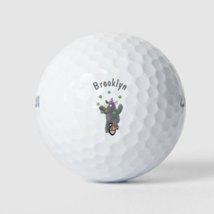 Funny cute rhino juggling on unicycle golf balls