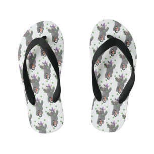 Funny cute rhino juggling on unicycle kid's flip flops
