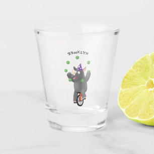 Funny cute rhino juggling on unicycle shot glass
