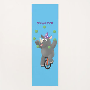 Funny cute rhino juggling on unicycle yoga mat