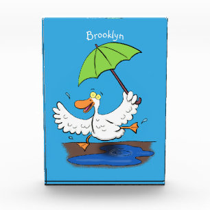 Funny duck with umbrella dancing cartoon photo block