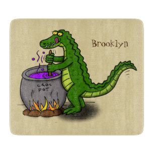 Funny green alligator cooking cartoon cutting board