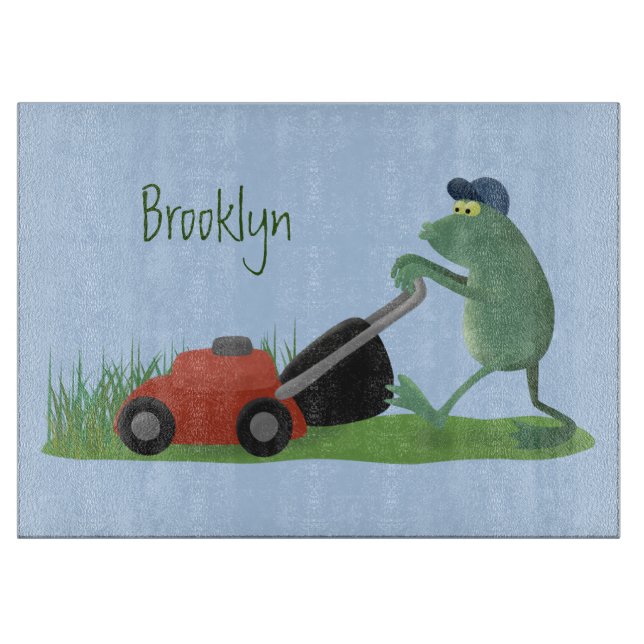 Funny green frog mowing lawn cartoon  cutting board (Front)