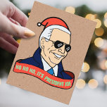 Funny Ho It's President Joe Biden Santa Christmas Postcard<br><div class="desc">"HO HO HO,  IT'S PRESIDENT JOE!" 
This political holiday humour postcard features a cartoon of president elect joe biden in sunglasses,  a deep blue overcoat,  a gleaming smile,   and a santa hat,  with a ribbon reading "HO HO HO,  IT'S PRESIDENT JOE!"</div>