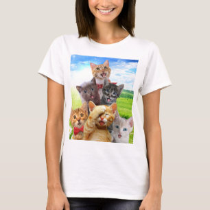 Funny kittens in green field.                      T-Shirt