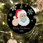Funny Masked Santa Commemorative Christmas Ceramic Tree Decoration<br><div class="desc">A commemorative christmas ornament to mark a year to remember! Featuring a masked Santa Claus with snowflakes,  'Merry Christmas' in calligraphy script text and the year. On the reverse you can personalise your xmas ornament with your family name.</div>