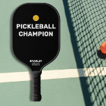 Funny Pickleball Champion Custom Text Name Pickleball Paddle<br><div class="desc">Surely you know someone who deserves this funny pickleball paddle that reads "Pickleball Champion". Design features Bold White text that's set against a black background and is highlighted by a yellow pickleball (you can easily change the background colour). Add 2 lines of custom text to personalise - club name, location,...</div>