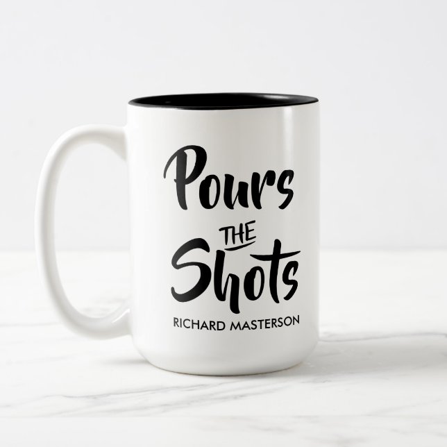 Funny Pours The Shots Calls The Shots Two-Tone Coffee Mug (Left)