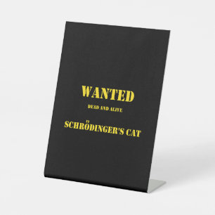 Funny Quantum Joke: Schrödinger’s Cat on the Loose Pedestal Sign