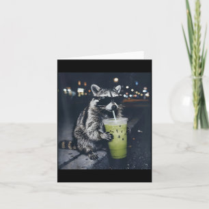 Funny racoon drinking iced matcha latte animal card