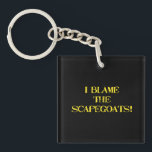 Funny Scapegoat Quote A Bold Statement on Blame Key Ring<br><div class="desc">This striking image delivers a punchy message—"I BLAME THE SCAPEGOATS!"—in distressed yellow stencil text against a stark black background. It's a satirical take on the human tendency to deflect responsibility,  making it perfect for social commentary,  humor,  or protest-themed content. #BlameCulture #SatireArt #ScapegoatStatement #BoldTypography</div>