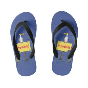 Funny sea bird circled by sharks cartoon kid's flip flops