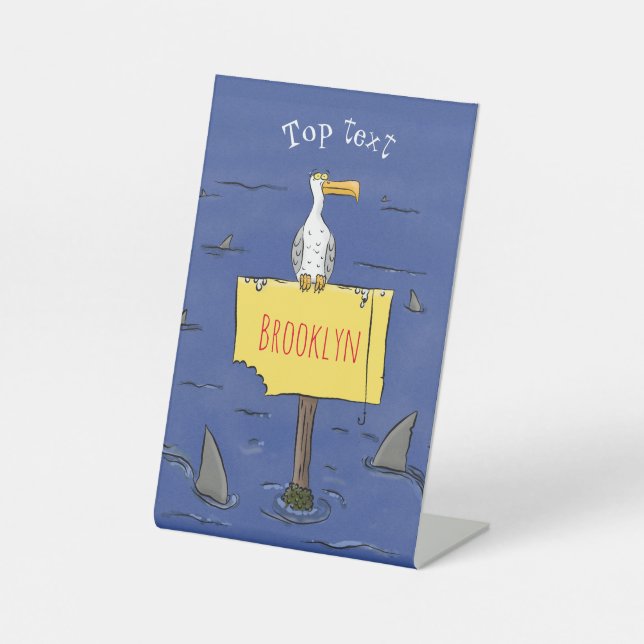 Funny sea bird circled by sharks cartoon pedestal sign (Front)