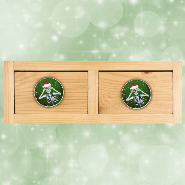 Funny skeleton Santa Hat Ornament gold Stars Green Ceramic Knob (Fun Christmas Skeleton shiny ornament eyes bright gold stars on dark green drawer pull knobs.)