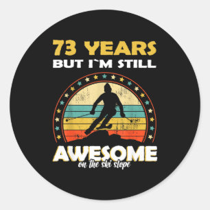 Funny skiing awesome 73 years old birthday classic round sticker
