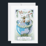 Funny Vintage Easter Bunnies in Egg Holiday Card<br><div class="desc">Whimsical vintage greeting card lithographic art featuring two white Easter bunnies in a dyed blue egg surrounded by lily-of-the-valley and clover with happy Easter greeting.</div>