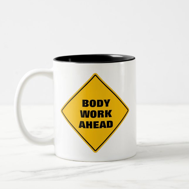 Funny yellow body work ahead caution road sign Two Two-Tone Coffee Mug (Left)
