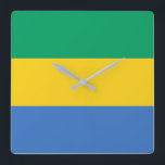 Gabon Flag Square Wall Clock<br><div class="desc">The Gabonese flag is a horizontal triband. The used colours in the flag are blue,  green,  yellow. The proportion of the Gabonese flag is 3:4. The Flag of Gabon was adopted in 1960.</div>