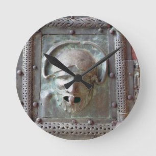 Gargoyle panel from the left door of the portal, 1 round clock