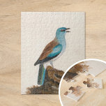 Garrulous Roller | William Lewin Jigsaw Puzzle<br><div class="desc">Garrulous Roller (before 1790) | William Lewin’s Garrulous Roller is a vibrant and meticulously detailed painting showcasing a striking brown and turquoise roller perched on a log against a minimalist neutral background. The artist masterfully captures the bird’s vivid plumage and poised stance, emphasising its natural beauty. The understated backdrop draws...</div>