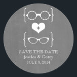 Geeky Glasses Chalkboard Save the Date Stickers<br><div class="desc">Quirky and chic Geeky Glasses Chalkboard Save the Date Stickers featuring a cute heart flanked by two pairs of nerdy eyeglasses, a manly pair and a girly pair representing the groom and bride on a chalkboard look background. These offbeat save the date stickers are perfect for announcing your geek wedding!...</div>