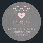 Geeky Glasses Chalkboard Save the Date Stickers<br><div class="desc">Quirky and chic Geeky Glasses Chalkboard Save the Date Stickers in light pink featuring a cute heart flanked by two pairs of nerdy eyeglasses, a manly pair and a girly pair representing the groom and bride on a chalkboard look background. These offbeat save the date stickers are perfect for announcing...</div>