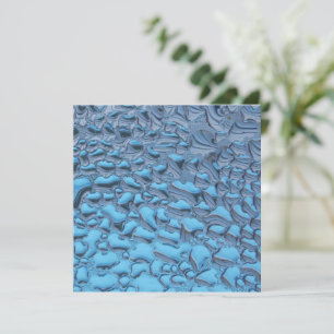 Gentle raindrops on blue glass