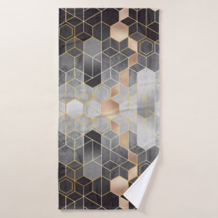Geometric abstraction of hexagons on a black and w bath towel