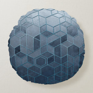 Geometric abstraction of hexagons on a blue relief round cushion