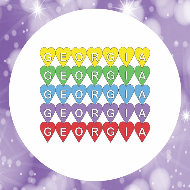 Georgia Rainbow Hearts Pattern Classic Round Sticker (A sticker that says Georgia in yellow, green, blue, red and purple hearts.)