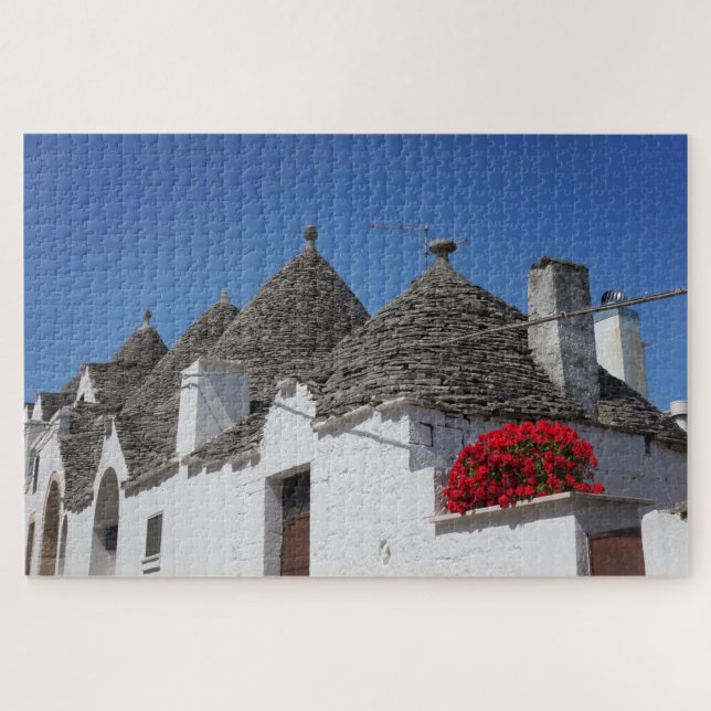 Geranium flowers and trulli houses in Alberobello Jigsaw Puzzle (Horizontal)