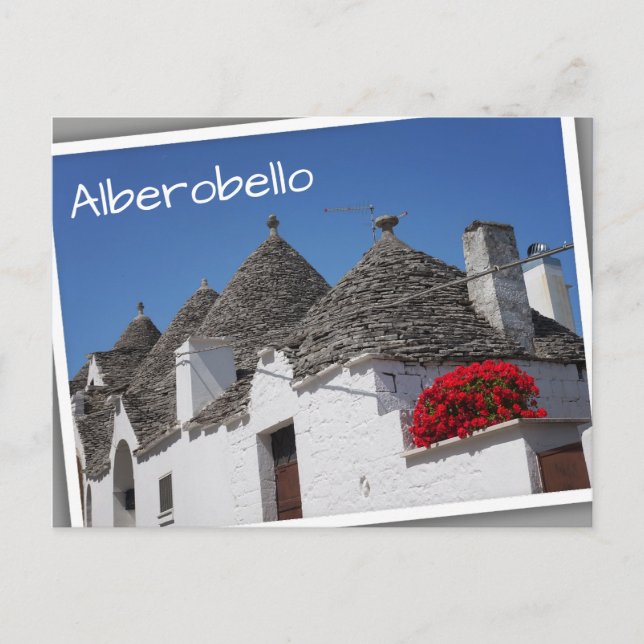 Geranium flowers and trulli houses in Alberobello Postcard (Front)