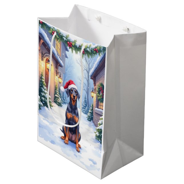German Pinscher Snowy Courtyard Santa Hat Medium Gift Bag (Front Angled)