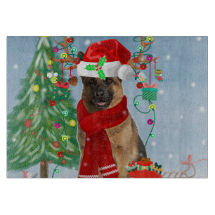 German Shepherd Dog in Snow with Christmas Gifts Cutting Board
